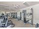 Well-equipped fitness center with treadmills, weight machines, and mirrors for a complete workout experience at 11550 Blackfin St, Venice, FL 34292