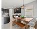 Kitchen with granite countertops, dining area, and view of the backyard at 11550 Blackfin St, Venice, FL 34292