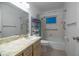 Well-maintained bathroom featuring a clean design with a tiled shower and tub combo and practical storage at 1208 Francis Ave, Sarasota, FL 34232