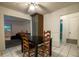 Bright dining area featuring tiled floor, contemporary light fixture, and convenient access to living room at 1208 Francis Ave, Sarasota, FL 34232