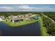 Aerial view of a lakeside home featuring a private pool and serene water views, offering an exclusive retreat at 15808 42Nd E Gln, Parrish, FL 34219