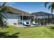 Relaxing backyard with a beautiful pool, a spacious deck area, and cozy lounge chairs, perfect for enjoying the outdoors at 15808 42Nd E Gln, Parrish, FL 34219