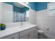 Bright bathroom with a single sink vanity, white cabinets, and framed mirror at 15808 42Nd E Gln, Parrish, FL 34219