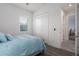 Comfortable bedroom featuring a closet, wood-look floors, and natural light from the window at 15808 42Nd E Gln, Parrish, FL 34219