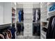 Spacious walk-in closet with custom shelving and drawers for optimal organization at 15808 42Nd E Gln, Parrish, FL 34219