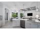 Kitchen featuring a center island, granite countertops, stainless steel appliances, and open floor plan at 15808 42Nd E Gln, Parrish, FL 34219