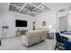 Cozy living area featuring a decorative ceiling, modern tile flooring, and comfortable seating at 15808 42Nd E Gln, Parrish, FL 34219