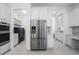 Pantry featuring a stainless steel refrigerator and modern appliances at 15808 42Nd E Gln, Parrish, FL 34219