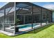 Enclosed pool area provides a private space for relaxation and entertainment in a lush, green backyard at 15808 42Nd E Gln, Parrish, FL 34219