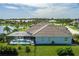 Aerial view of the rear of the house, showcasing a private screened pool area and expansive backyard space at 15808 42Nd E Gln, Parrish, FL 34219