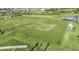 Expansive green soccer field surrounded by lush landscaping, ideal for sports and outdoor activities at 16415 Star Grass Cir, Bradenton, FL 34211