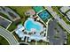 Aerial view of community pool, tennis courts, playground, and parking area at 18068 Cherished Loop, Bradenton, FL 34211