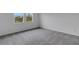 Bedroom with carpet and natural lighting from the two windows at 18068 Cherished Loop, Bradenton, FL 34211