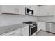 Contemporary kitchen showcasing stainless steel appliances, granite countertops and subway tile backsplash at 18068 Cherished Loop, Bradenton, FL 34211