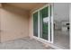 The covered patio has brick pavers and sliding glass doors leading to the interior of the home at 18068 Cherished Loop, Bradenton, FL 34211