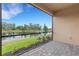 Screened-in patio overlooks a pond with beautiful landscaping and an expansive view at 18068 Cherished Loop, Bradenton, FL 34211