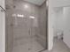 Luxurious tiled shower with a glass door and built-in bench for added comfort at 18068 Cherished Loop, Bradenton, FL 34211