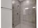 Modern shower featuring gray tile and a glass enclosure, offering a spa-like experience at 18068 Cherished Loop, Bradenton, FL 34211