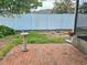 Backyard patio featuring brick pavers, landscaping, and privacy fence at 2004 40Th W St, Bradenton, FL 34205