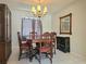 Charming dining room featuring a wood table, six chairs, and an elegant chandelier at 2004 40Th W St, Bradenton, FL 34205