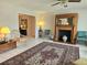 Cozy living room featuring a fireplace, tile floors, and ample seating at 2004 40Th W St, Bradenton, FL 34205