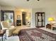 Inviting living room with a beautiful rug, tile floors, and display cases at 2004 40Th W St, Bradenton, FL 34205