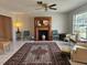 Comfortable living room featuring a fireplace, rug, and tile flooring at 2004 40Th W St, Bradenton, FL 34205