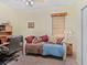 Bedroom featuring carpeted floors, a ceiling fan and plenty of natural light at 280 Dahlia Ct, Bradenton, FL 34212