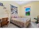Bedroom with carpet floors and a large window overlooking the backyard at 280 Dahlia Ct, Bradenton, FL 34212