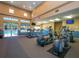 Bright fitness center with modern equipment, large windows, and poolside views at 280 Dahlia Ct, Bradenton, FL 34212