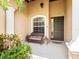 Welcoming front porch with a cozy bench, perfect for enjoying the outdoors at 280 Dahlia Ct, Bradenton, FL 34212
