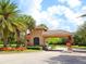 Charming guard house at community entrance, adorned with lush landscaping and stately architecture at 280 Dahlia Ct, Bradenton, FL 34212