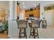 Eat-in kitchen with bar seating, and a view to the living area beyond at 280 Dahlia Ct, Bradenton, FL 34212