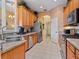 Spacious kitchen featuring modern stainless appliances, natural wood cabinets, and neutral countertops at 280 Dahlia Ct, Bradenton, FL 34212