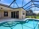 Inviting outdoor pool with a screened-in enclosure, perfect for relaxation and entertainment at 280 Dahlia Ct, Bradenton, FL 34212