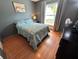 Bedroom features hardwood floors, natural light from the window, and neutral paint at 3918 Wake Ave, Sarasota, FL 34241