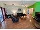 Bright living room with wood floors, comfortable furniture, and sliding doors at 3918 Wake Ave, Sarasota, FL 34241