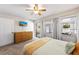 Inviting bedroom with a ceiling fan, neutral color palette, and access to a screened-in porch at 441 62Nd St, Holmes Beach, FL 34217