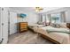 Comfortable bedroom with two twin beds, stylish dresser, and serene decor for a relaxing retreat at 441 62Nd St, Holmes Beach, FL 34217