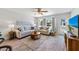 Inviting living room with stylish furniture, accent pillows, and a ceiling fan for added comfort at 441 62Nd St, Holmes Beach, FL 34217