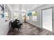 Cozy sunroom with beachy decor, comfortable seating, and plenty of natural light at 441 62Nd St, Holmes Beach, FL 34217