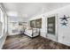 Bright sunroom featuring a daybed, crisp white walls, and stylish starfish decor at 441 62Nd St, Holmes Beach, FL 34217