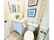 Bathroom featuring a vanity with white cabinets and a walk-in shower at 5238 Sunridge Palms Dr, Tampa, FL 33617