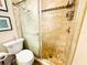 Modern bathroom featuring a glass shower and tile walls at 5238 Sunridge Palms Dr, Tampa, FL 33617