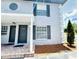 Stylish apartment complex featuring a covered porch and well-maintained landscaping at 5238 Sunridge Palms Dr, Tampa, FL 33617