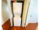 Efficient laundry closet featuring a stacked washer and dryer unit at 5238 Sunridge Palms Dr, Tampa, FL 33617