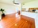 Open-concept living space featuring laminate flooring, kitchen view, and a ceiling fan at 5238 Sunridge Palms Dr, Tampa, FL 33617