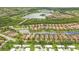 Aerial view of single Gathering homes and mobile homes, gorgeous landscaping and a lovely lake nearby at 5596 Cantucci St, Nokomis, FL 34275