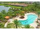 Aerial view of the community pool and surrounding neighborhood, highlighting the beautiful waterfront location at 5596 Cantucci St, Nokomis, FL 34275