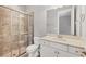 Bathroom featuring a glass shower, toilet and vanity with a sink and a large mirror at 5596 Cantucci St, Nokomis, FL 34275